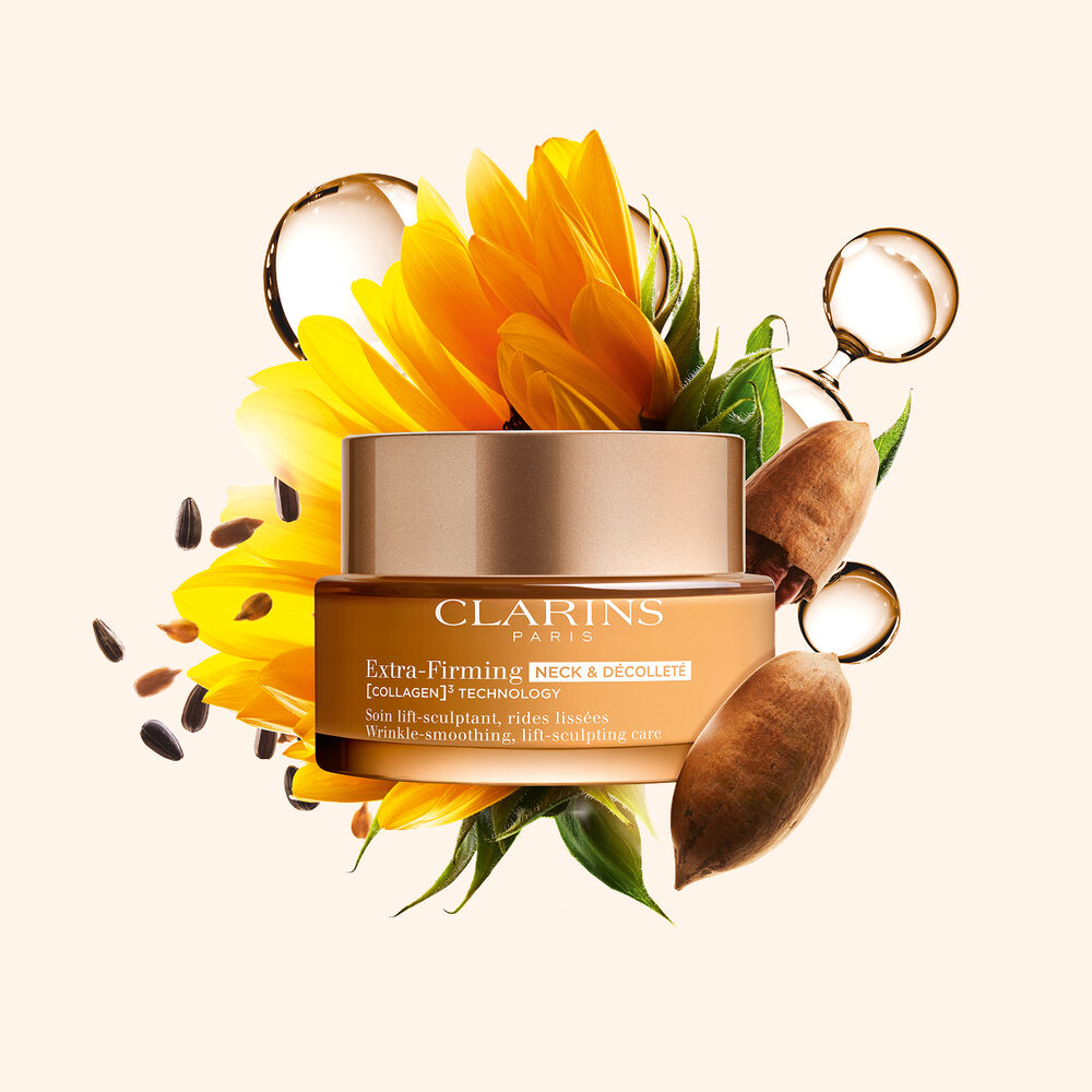 Packshot of Clarins Firming Neck & D&eacute;collet&eacute; Cream surrounded by collagen, pecan nuts, and sunflower, highlighting its key firming ingredients.