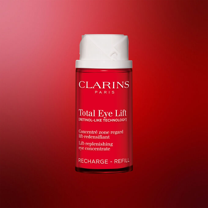 Packshot of Clarins Total Eye Lift anti-aging eye cream refill packaging on a dark red background, highlighting its sustainable refillable design