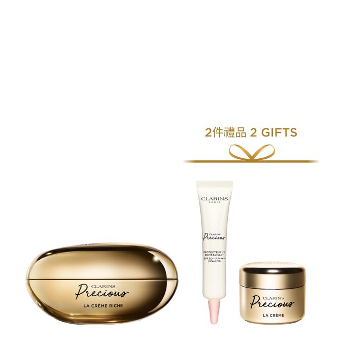 Packshot of Clarins Precious Rich Cream close to a Moonlight flower on dark background.
