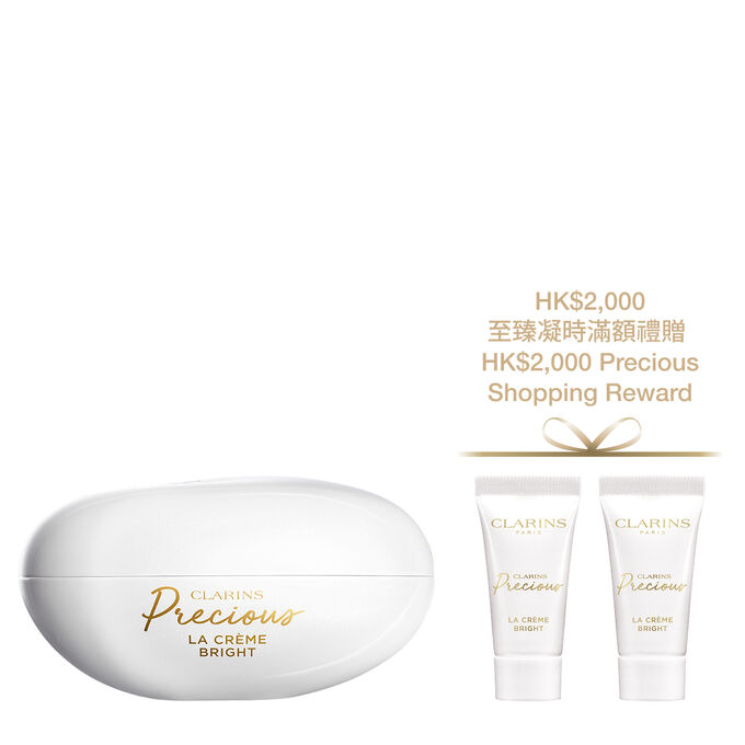 Packshot of Clarins Precious Bright Cream, surrounded by Moonlight Flower and Peptide Molecules, illustrating key ingredients for anti-aging.