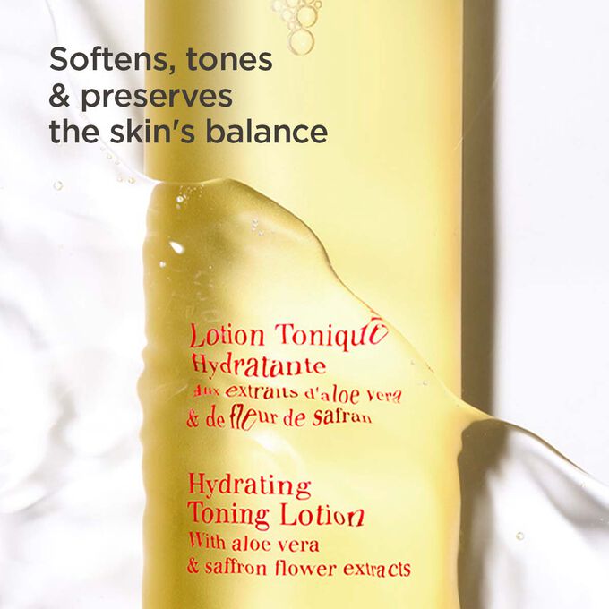 Clarins Hydrating Toning Lotion bottle half under water, highlighting its hydrating, softening, and toning effects on the skin