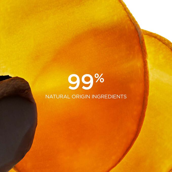 Close-up of wild mango slides to highlight that 99% of the ingredients in Clarins Comfort Scrub are of natural origin.