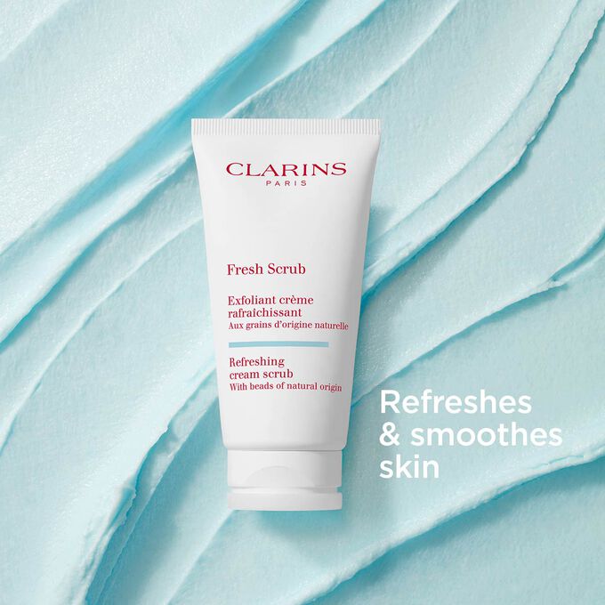 Clarins Fresh Scrub for the face on a textured creamy background to emphasize its smoothing and refreshing actions.