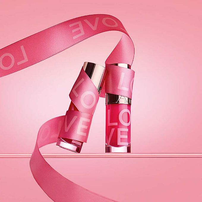 Limited edition Love Collection by Clarins, featuring a Lip Oil, Fix Make-Up, Lip Balm, and Hand Cream for a complete skincare experience