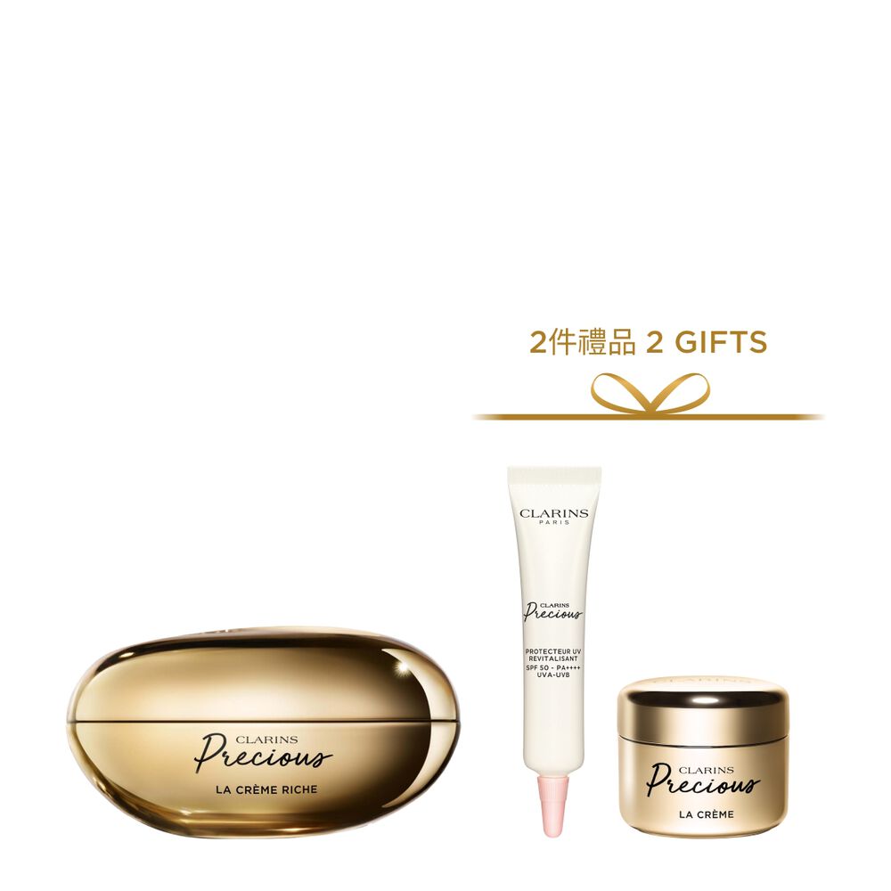 深色背景中的Clarins Precious至臻凝時面霜（滋潤型）的宣傳照，旁邊有一朵月神花。